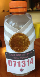 mini gatorade bottles with gold coins and striped ribbon to look like a medal and a mini running bib
